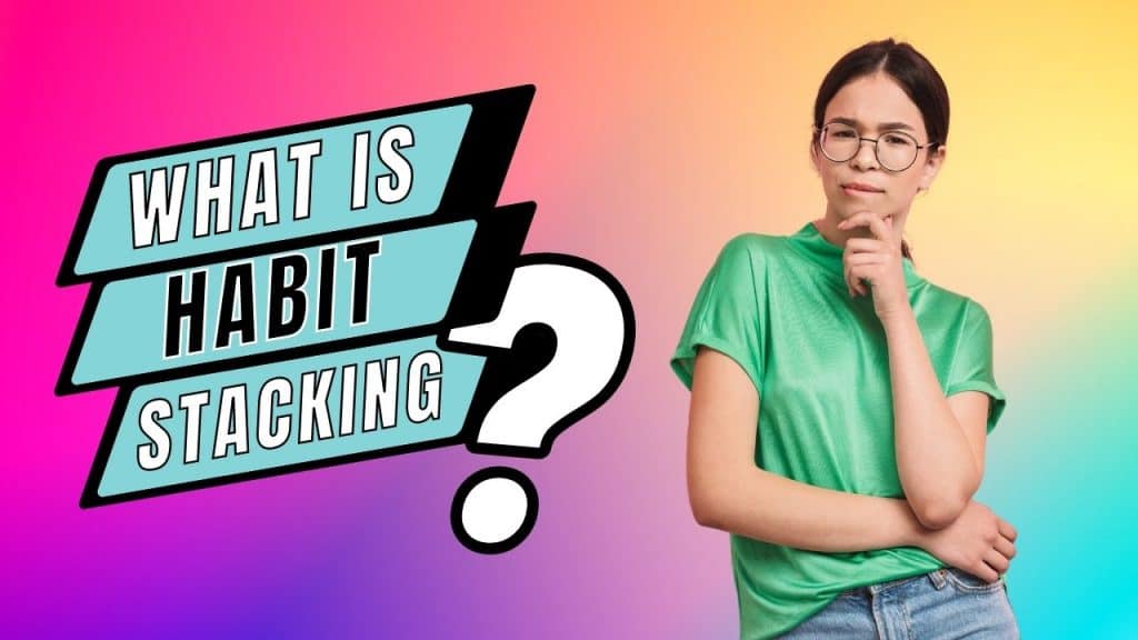A woman with glasses and a green t-shirt holds her hand to her chin in a questioning post. The title reads What is habit stacking?