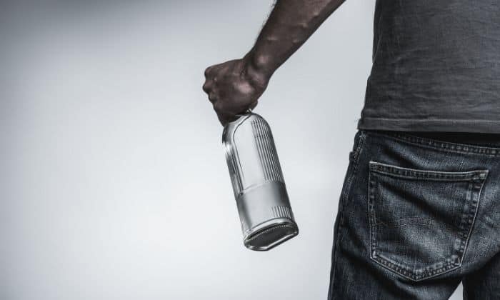 man with bottle of alcohol