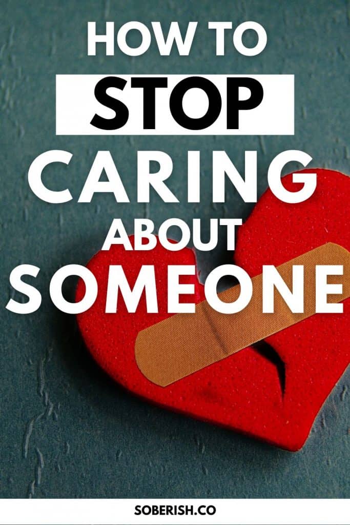 A ripped, red felt heart has a bandaid on it and rests on a slate gray backdrop. The title reads How to stop caring about someone. The URL says soberish.co