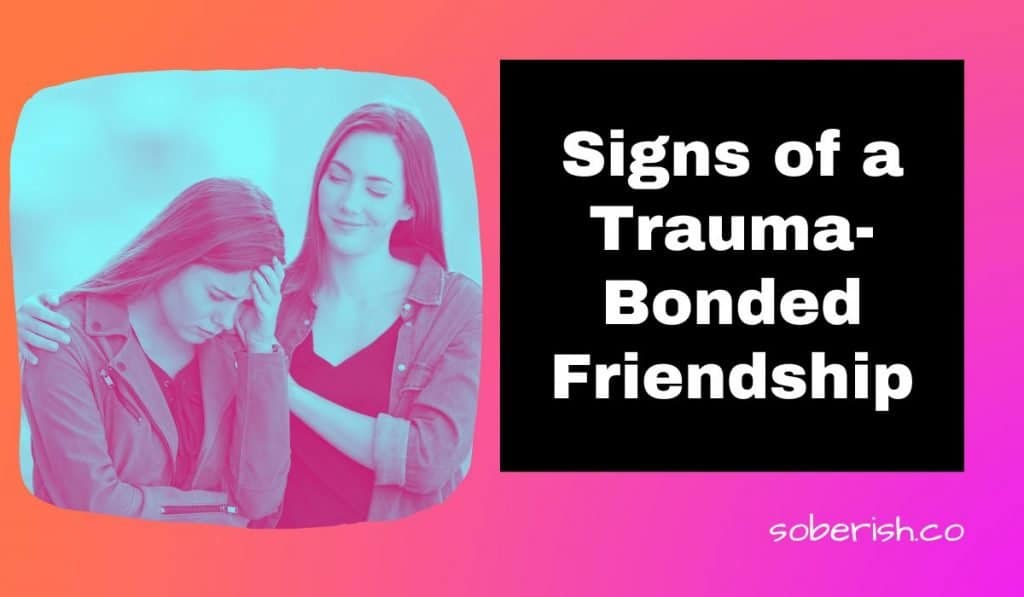 A woman smirks as she puts her hands on her friend's shoulder. Her friend looks upset. The title reads Signs of a Trauma-Bonded Friendship