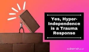 A man attempts to lift a large brick by himself. The title reads yes, hyper independence is a trauma response