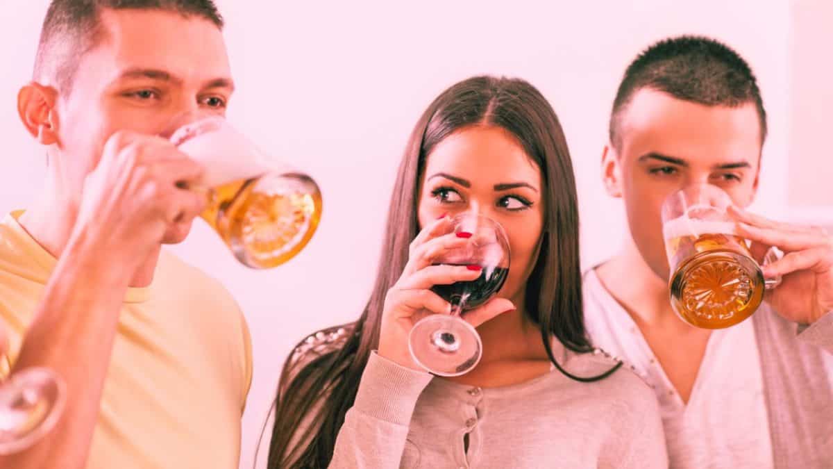 Two men and a woman drink alcohol unable to stop