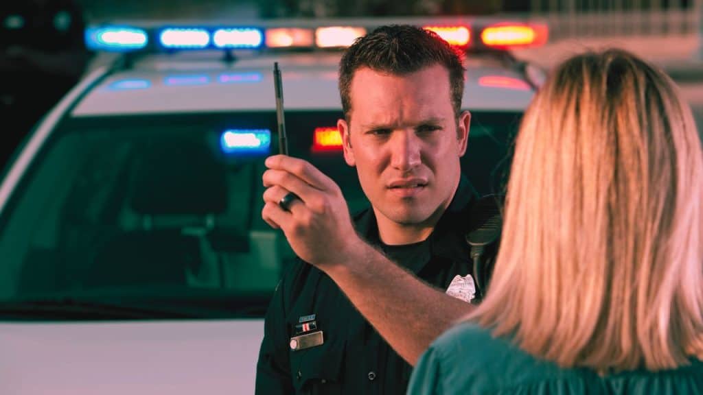 A police officer conducting a field eye sobriety test